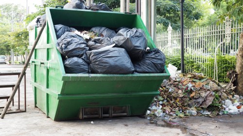 Waste removal truck servicing a business location